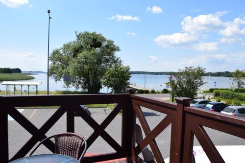 a balcony with a view of a parking lot at Stara Kuźnia Mazurska in Węgorzewo