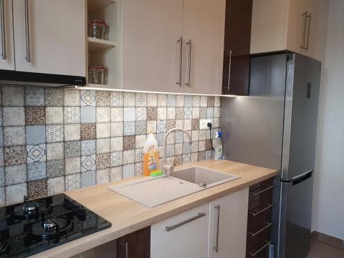Dapur atau dapur kecil di Flower Apartment
