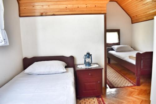 מיטה או מיטות בחדר ב-Holiday Home Amzici