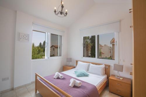 Llit o llits en una habitació de Mandali Villa