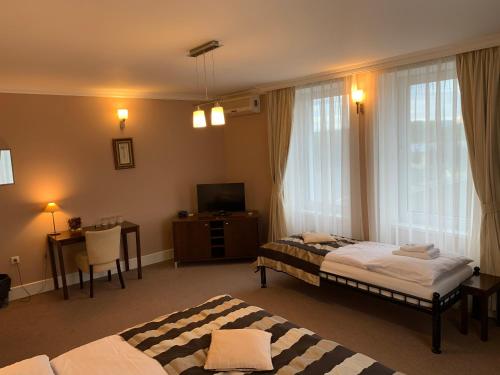 Postel nebo postele na pokoji v ubytování Pension Eden
