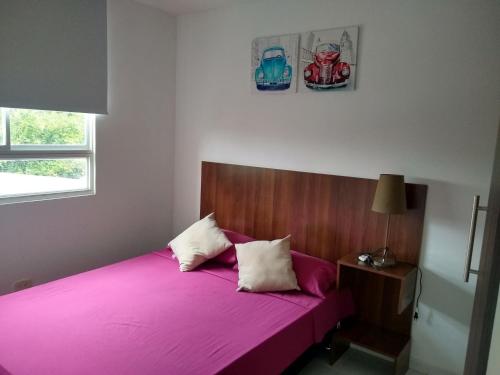 Llit o llits en una habitació de CH3 Moderno apartamento amoblado en condominio RNT-1O8238