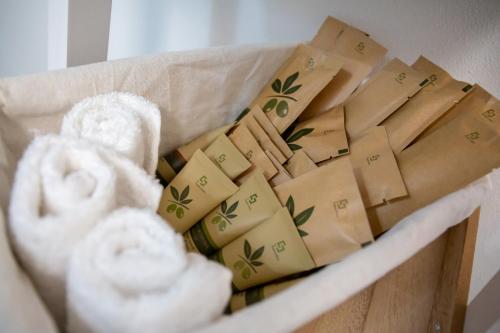 a basket filled with cheese and towels at Hotel Ariadimari in Valledoria