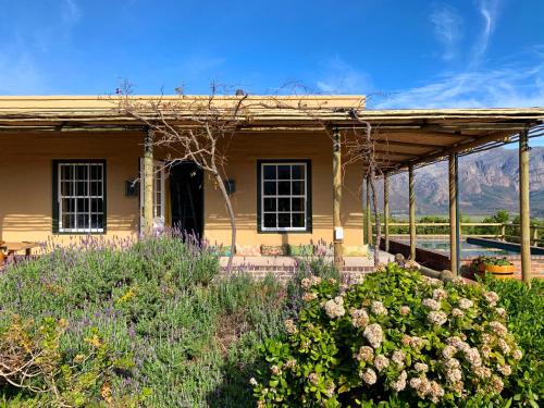 a house with a garden in front of it at 7 Koppies in Franschhoek