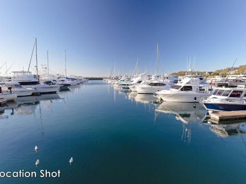 a bunch of boats are docked in a marina at Nelson Towers, 9,71a Victoria Parade - unit in the heart of Nelson Bay with water views, air conditioning and Wi-Fi in Nelson Bay