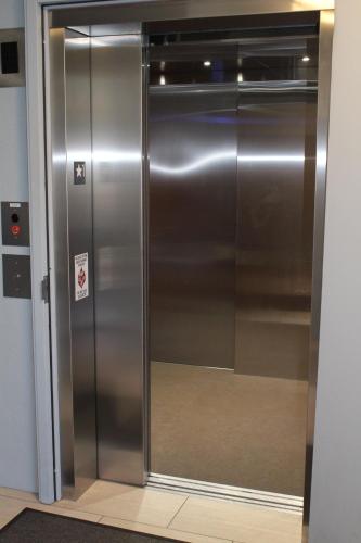 a large stainless steel refrigerator in a building at Beck's Motor Lodge in San Francisco