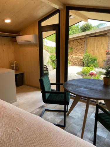 a room with a table and a chair and a table at Apartments Pri nas in Kobarid