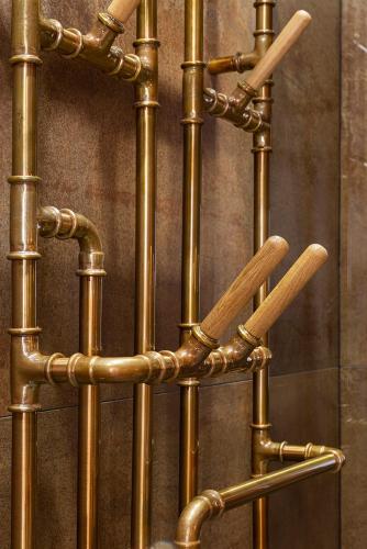 a bunch of gold bamboo poles with baseball bats at Green Deer Premium in Zakopane