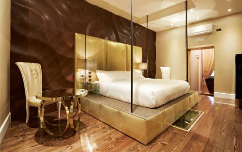 Cama ou camas em um quarto em Spagna Royal Suite