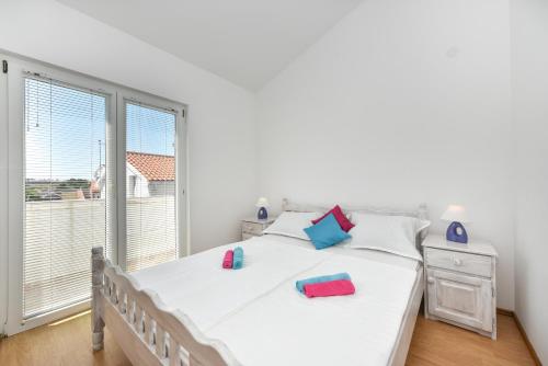 Voodi või voodid majutusasutuse Apartments Krepo toas