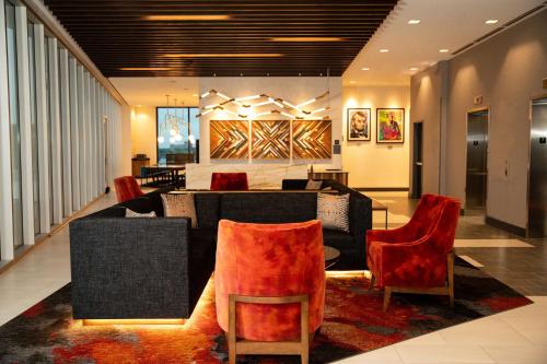 a lobby with couches and chairs in a building at Hyatt Place Chicago Wicker Park in Chicago