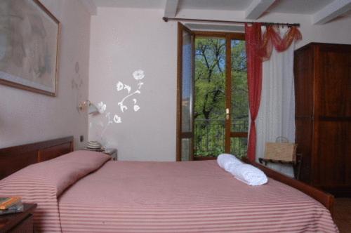 Postel nebo postele na pokoji v ubytování Hotel Residence Sant'Uberto