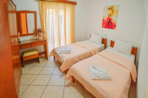 Postel nebo postele na pokoji v ubytování Villa Mimagia Apartments