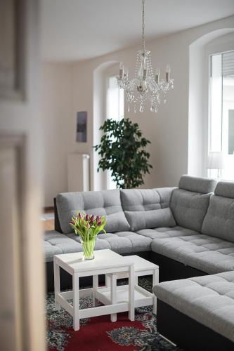 a living room with a couch and a table at Appartement Schloßstraße in Ballenstedt