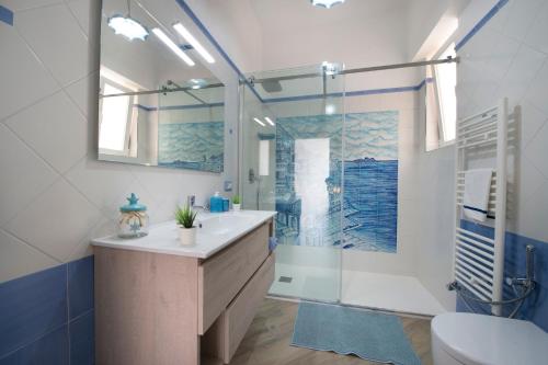 a bathroom with a shower and a sink and a toilet at Casa Licia in Positano