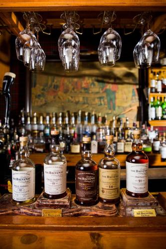 a group of bottles of whiskey on a shelf at Antrim 1844 in Taneytown
