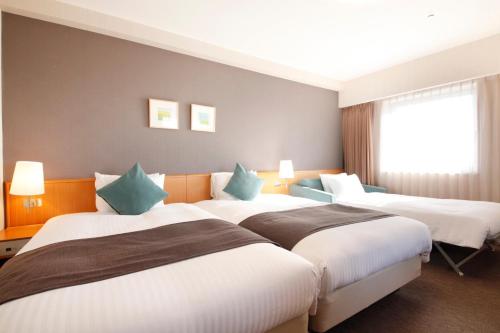 Postelja oz. postelje v sobi nastanitve Richmond Hotel Obihiro Ekimae