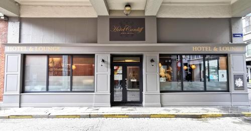 a store front of a building with the doors open at Hotel Cardiff in Ostend