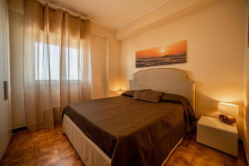 Postel nebo postele na pokoji v ubytování Mondello - Addaura - Le Dimore dello Zodiaco - Dimora dell Acquario