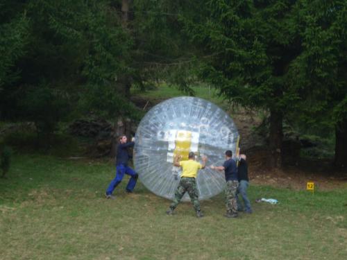 a group of men playing with a large ball at Chata Žiar in Rajecká Lesná
