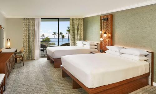 Ein Bett oder Betten in einem Zimmer der Unterkunft Hyatt Regency Maui Resort & Spa