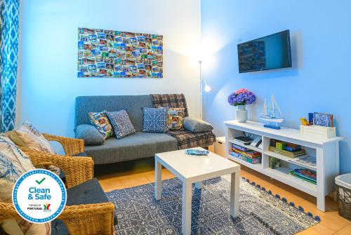 a living room with a couch and a table at Terrace Matosinhos House in Matosinhos