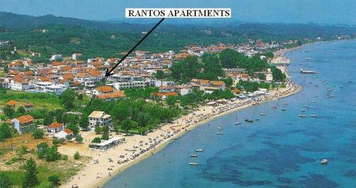 an aerial view of a beach with boats in the water at Rantos Apartments in Kavos