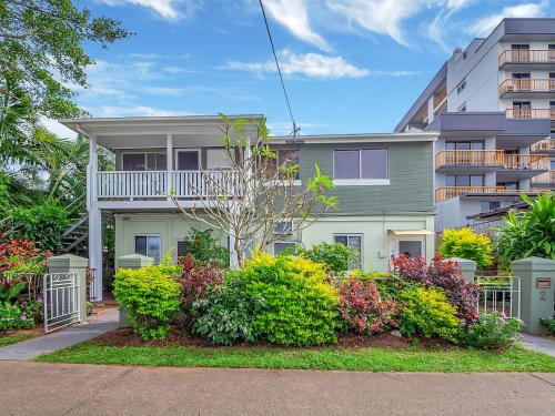 a apartment building with a garden in front of it at A Touch of the Bahamas on McKenzie MK3 in Cairns