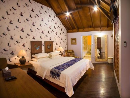 Cama o camas de una habitación en Tegal Panggung Guest House
