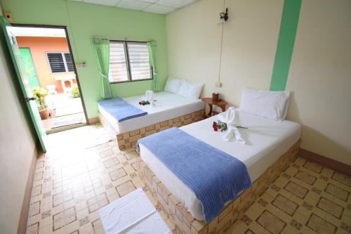 Postel nebo postele na pokoji v ubytování Mukda Guesthouse