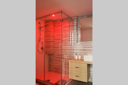 a bathroom with a glass shower with a sink at Via Mare in Ginosa Marina