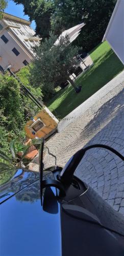 a close up of the reflection of a pair of glasses on a car at Gold Hotel in Bordighera