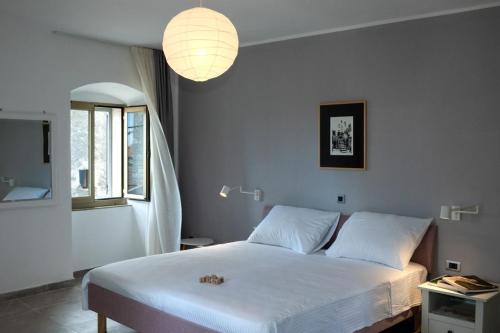 A bed or beds in a room at Moderno 3 Casa Vecchia
