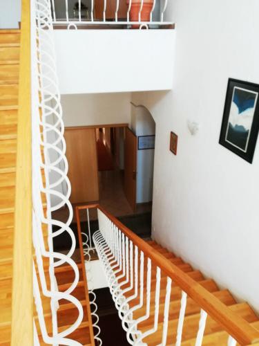 a spiral staircase leading up to the second floor of a house at Hotel Margit in Trenčianske Teplice