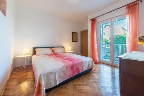 Ένα ή περισσότερα κρεβάτια σε δωμάτιο στο Apartments Fortica