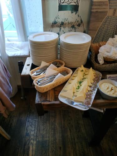 a table with a tray of cheese and plates at Eventhaus Schamin in Erpen
