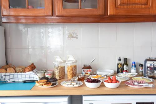 a kitchen counter with a bunch of food on it at Blue Door Lagos in Lagos