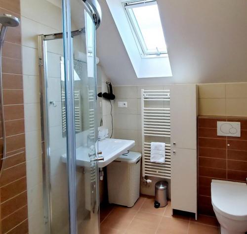 a bathroom with a sink and a shower at Apartments Highland in Stará Lesná