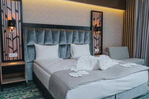 Кровать или кровати в номере Hotel President