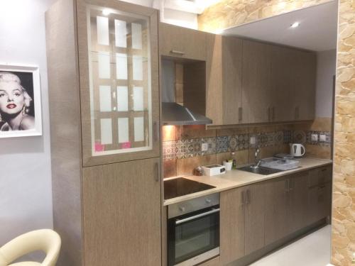 a kitchen with a sink and a stove at 6-Stylish mini-suite for 4 people in central Rhodes! in Rhodes Town