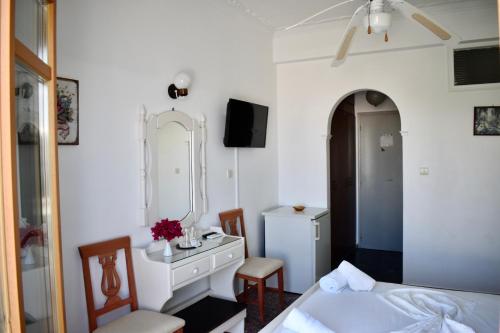 Postel nebo postele na pokoji v ubytování Minoa Hotel