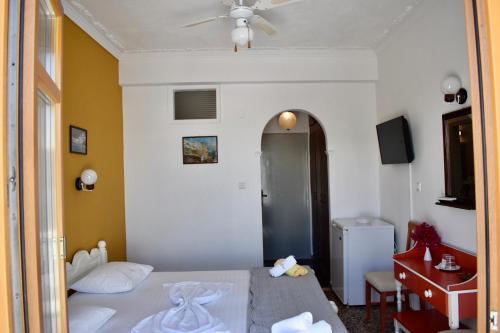 Postel nebo postele na pokoji v ubytování Minoa Hotel