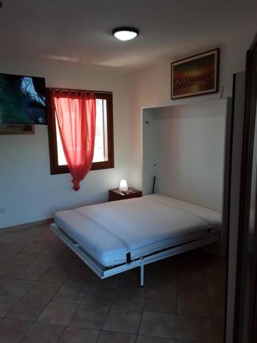 A bed or beds in a room at da Giulia le mimose