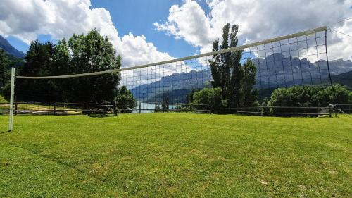 a soccer goal in a field with mountains in the background at Peña Sabocos, apartamento turístico Panticosa in Panticosa