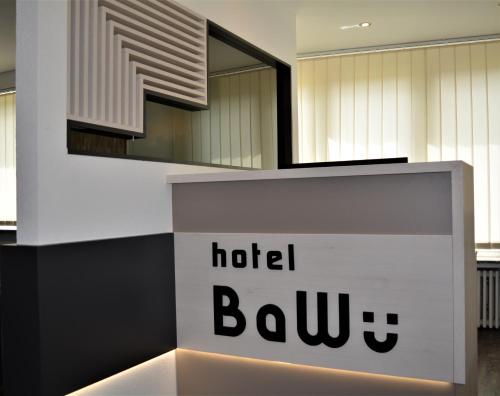 a hotel lobby with a hotel bum sign on a counter at Hotel BaWü in Stuttgart