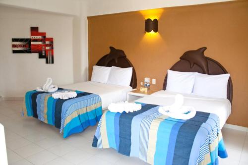 Katil atau katil-katil dalam bilik di Hotel Bahia Huatulco