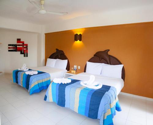 Katil atau katil-katil dalam bilik di Hotel Bahia Huatulco