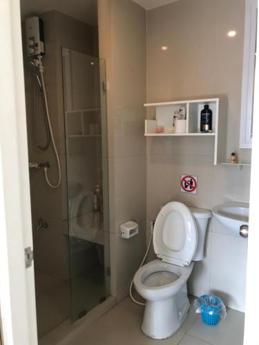 a bathroom with a shower and a toilet and a sink at river front in Nonthaburi