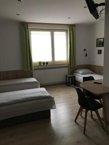 Posteľ alebo postele v izbe v ubytovaní Kathia Pokoje Gościnne