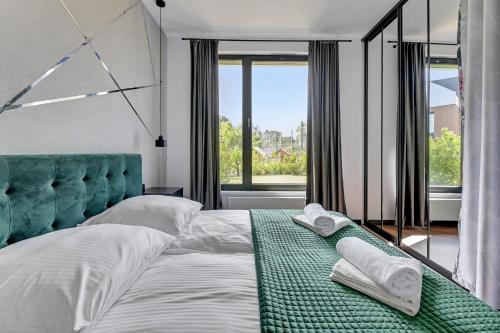 Posteľ alebo postele v izbe v ubytovaní Botanica Premium Apartments